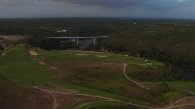 Golf course and bridge in background over Chavon river. La Romana