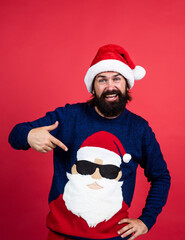 bearded santa man in hat smiling while prepare for celebrating happy new year party and christmas holiday in winter going to have xmas presents, winter fashion