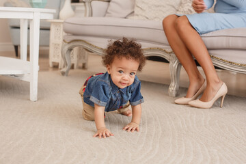 Naklejka premium Love of a mother and baby. Son and mom. Family in the house. Lifestyle