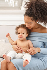 Love of a mother and baby. Son and mom. Family in the house. Lifestyle