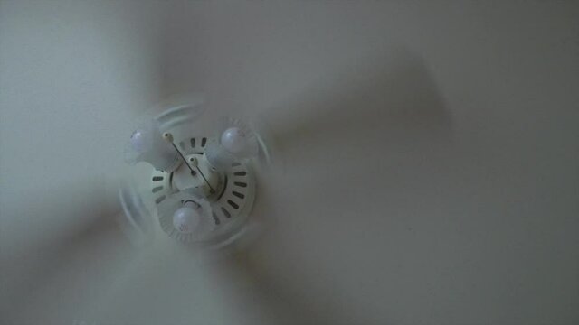Kitchen Ceiling fan and wood cabinet sliding shot