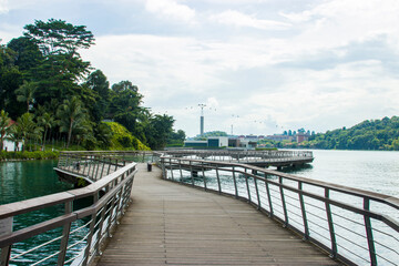 Fototapeta na wymiar Singapore Nov 17th 2020: the view of Bukit Chermin Boardwalk in Labrador nature reserve. The background is Sentosa cable car and island. 