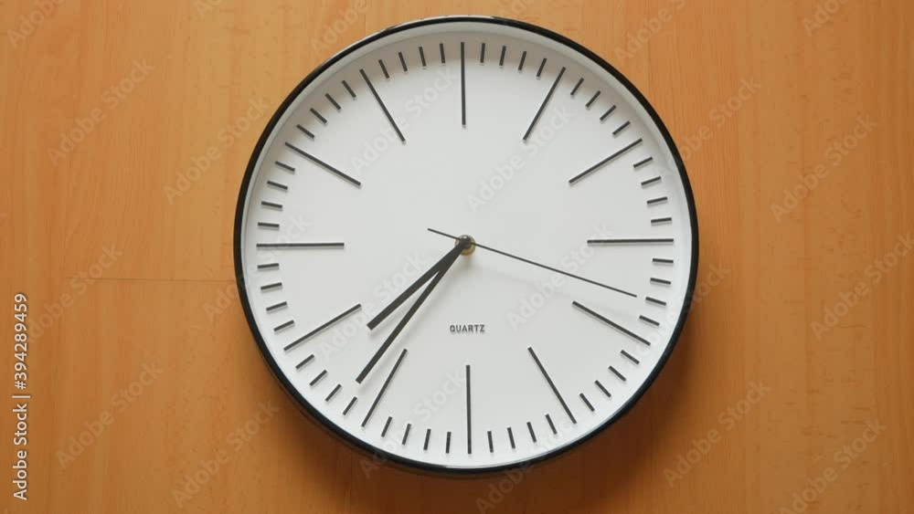 Poster time lapse of one minute on quartz clock face. - close up static shot