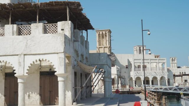 Traditional Buildings With Wind Towers In Al Fahidi Historical District (Al Bastakiya) In Dubai - sideway shot
