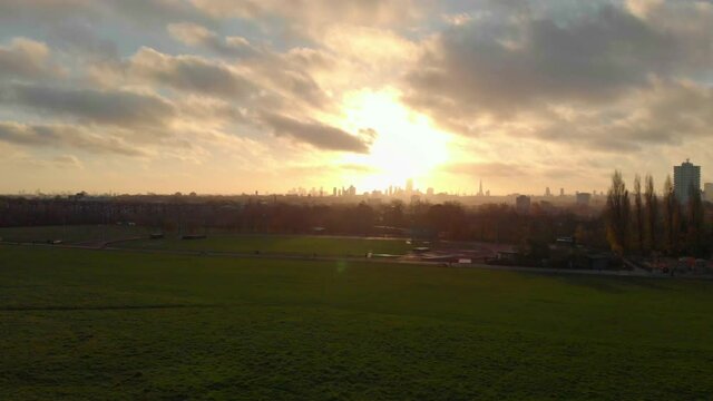 Rising drone shot of beautiful sunrise over London skyline