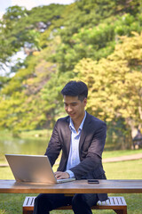 Asian business men working in the garden
