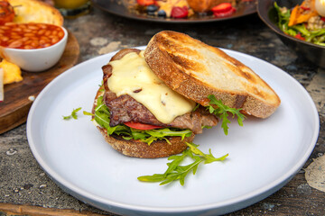 Steak Sandwich with cheese Lettuce and Tomato