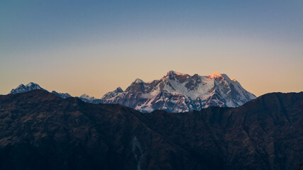 Mystical Chaukhamba peaks of Garhwal Himalayas during twilight from Deoria Tal camping site near Tungnath of Uttarakhand.