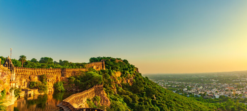 View during sunset from Chittor or Chittorgarh Fort with city in backdrop. It is one of the largest forts in India &  listed in the UNESCO World Heritage Sites list as Hill Forts of Rajasthan.