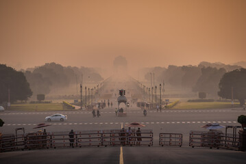 Silhouette of triumphal arch architectural style war memorial during hazy morning. Pollution level rises and causes smog in autumn season due stagnant winds.