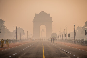 Fototapeta na wymiar Silhouette of triumphal arch architectural style war memorial during hazy morning. Pollution level rises and causes smog in autumn season due stagnant winds.