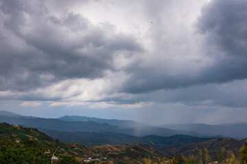 Naklejka na ściany i meble Overcast sky over lower himalayas mountains from Shimla Highway near Barog, Himachal Pradesh. It is a popular hill station for holidays in India