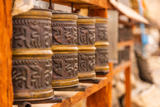Prayer wheels mantra written in Sanskrit 'Om Mani Padme Hum' meaning compassion,ethics,patience, diligence, renunciation & wisdom in English at Budhhist monastery in Nako, Kinnaur, Himachal Pradesh.