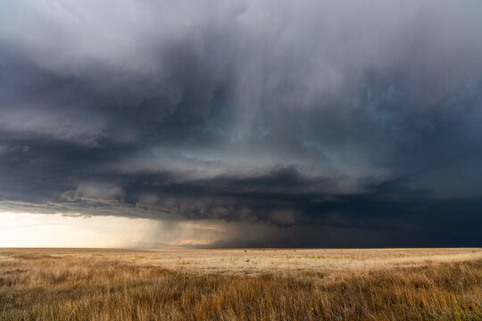 Dark storm clouds over a field in Kansas
