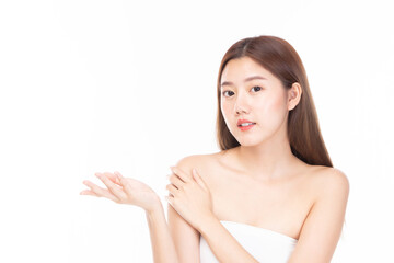 Beautiful spa model girl with perfect fresh clean skin. Beauty woman face portrait showing empty copy space on the open hand palm for text  on white background.