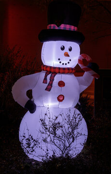 Inflated Snowman Glowing in the dark during Christmas Season