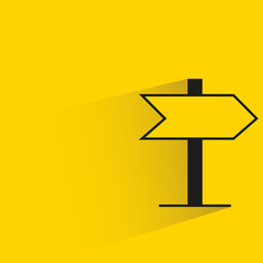 road signage with shadow on yellow background
