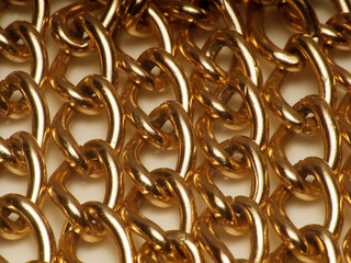 Macro shoot of gold color chain, isolated on white