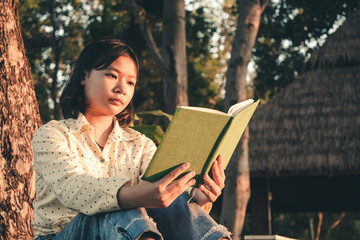 Women read book in the holiday in quiet nature, Concept reading a book.