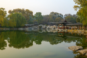 Fototapeta na wymiar In autumn, ancient building lofts and ginkgo trees are in Jinci Park, Taiyuan, Shanxi, China