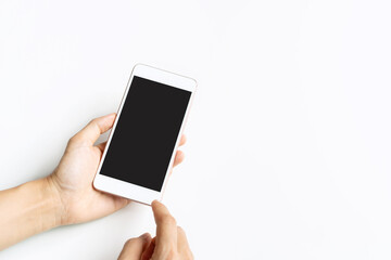 Closeup studio shot hand using mobile phone blank touch screen. Isolated on white background. Copy space