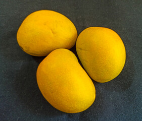 ripe mangos arrangement with black isolated background