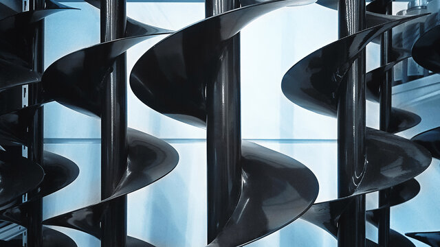 Many big black augers on the store stand