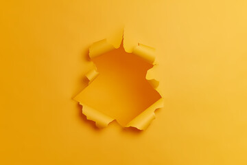 Big paper hole in center of yellow background. Blank space to insert your advertising content promotion or text information. Torn ripped studio wall. Breakthrough concept. No people in shot. - obrazy, fototapety, plakaty
