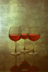 Still life with glasses of wine on a blurred background
