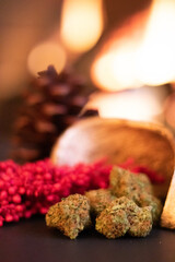 Festive cannabis in front of a roaring fire