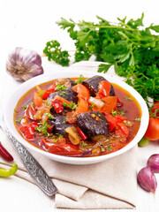 Ragout vegetable with eggplant on wooden board