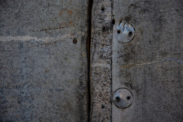 Garage corrosion on a rough metal wall or floor, scratches, air holes, nails, keys, holes, dents, pins.