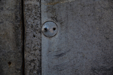 Garage corrosion on a rough metal wall or floor, scratches, air holes, nails, keys, holes, dents, pins.