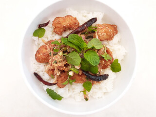 Jasmine rice with fried chicken in a bowl, Thai food.