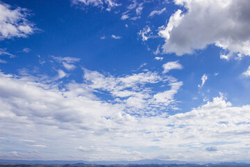 The vast sky is bright beautiful white clouds and mountain of the new morning.