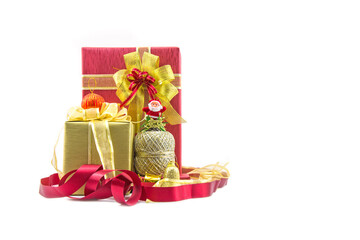 Christmas new year celebration decorations concept - Red and ribbon gold gifts box and decorating elements isolated on white background.