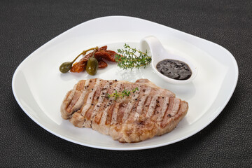 Grilled pork steak with pepper sauce