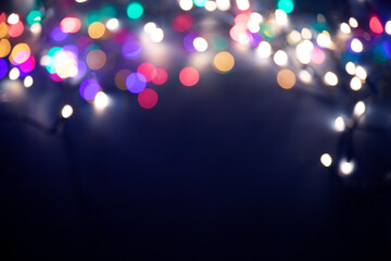 Christmas lights over dark blue background