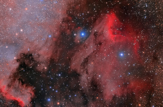 Space nebula, stars glow red and blue in space. Long exposure astronomical photography. Photo of real space through a telescope...IC 5070