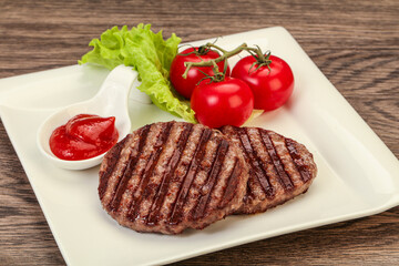 Grilled burger cutlet with sauce