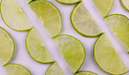 Sliced green lime background. Lime slices on white background