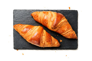 Fresh croissants isolated on a white background. top view
