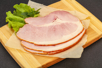 Sliced pork belly over board