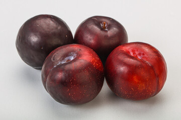 Ripe sweet plum fruit heap