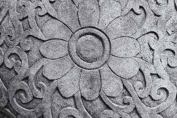 Flower carved on stone. Stone carving.