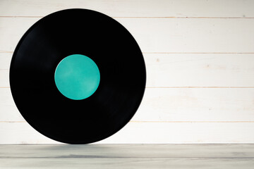 Vinyl record on wooden background,Old vintage vinyl record isolated