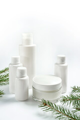 Christmas composition with cosmetic products on a white background.