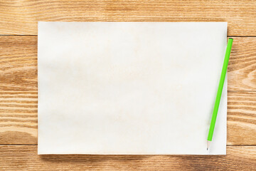 Sheet of paper lying on wooden table