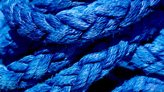 Yachting ropes or lines in pile, blue color texture, synthetic fibres