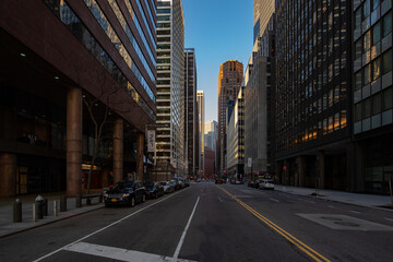 New York street view with modern tall buildings, old historic buildings and people